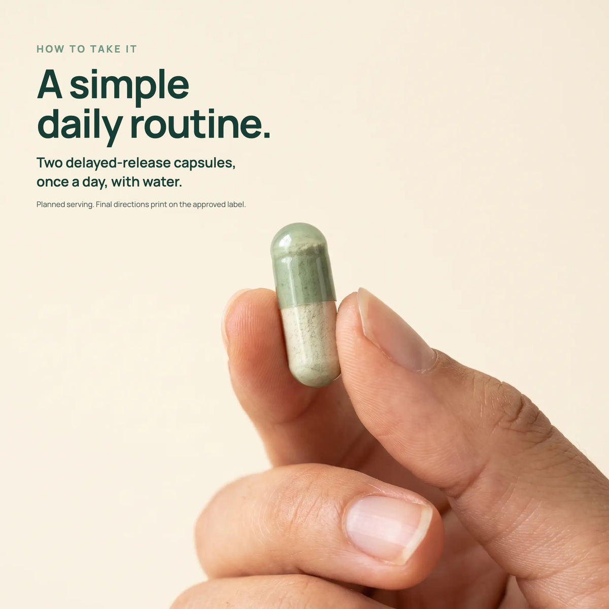 A delayed-release capsule held between two fingers