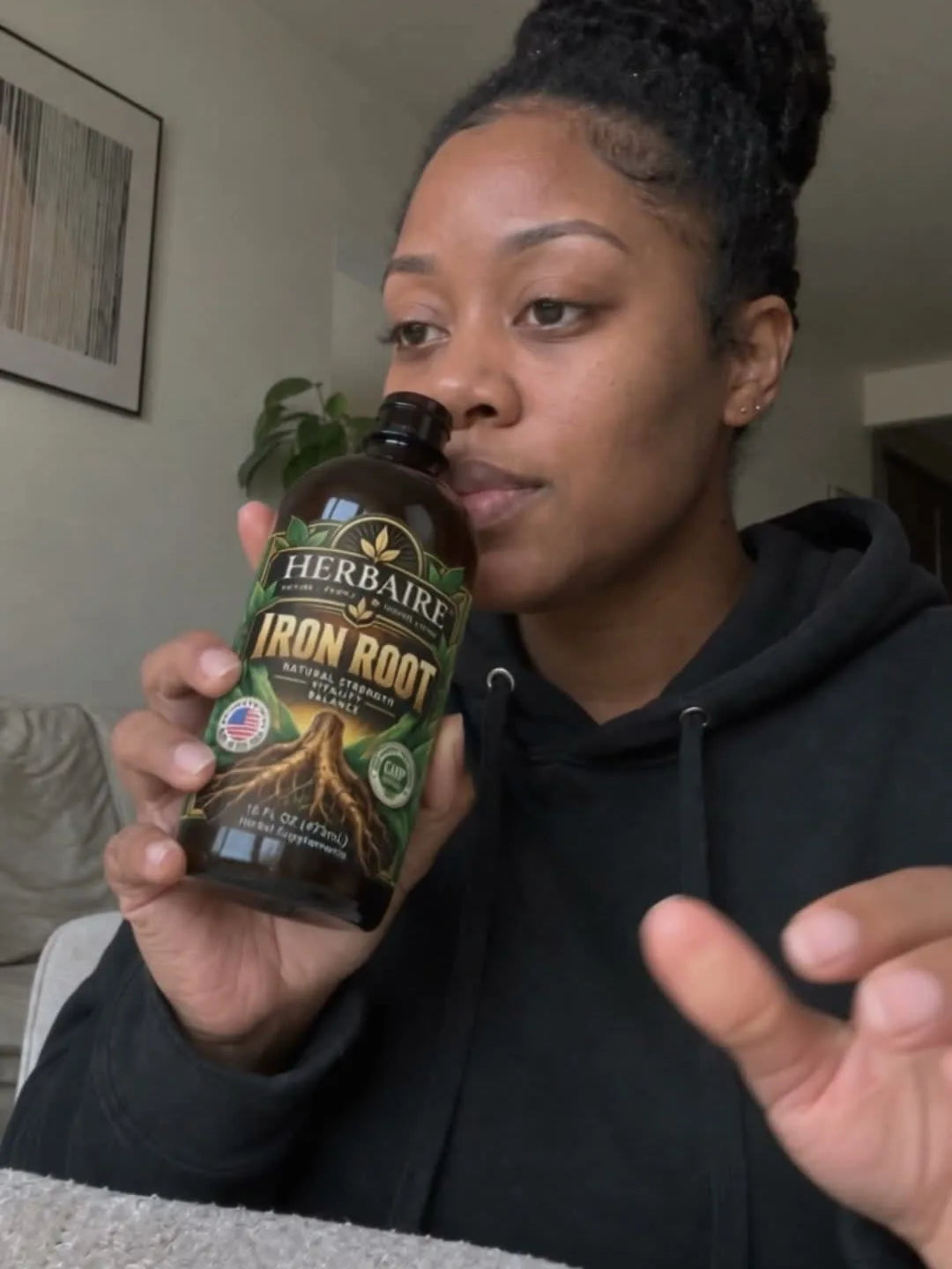 A woman holding Iron Root