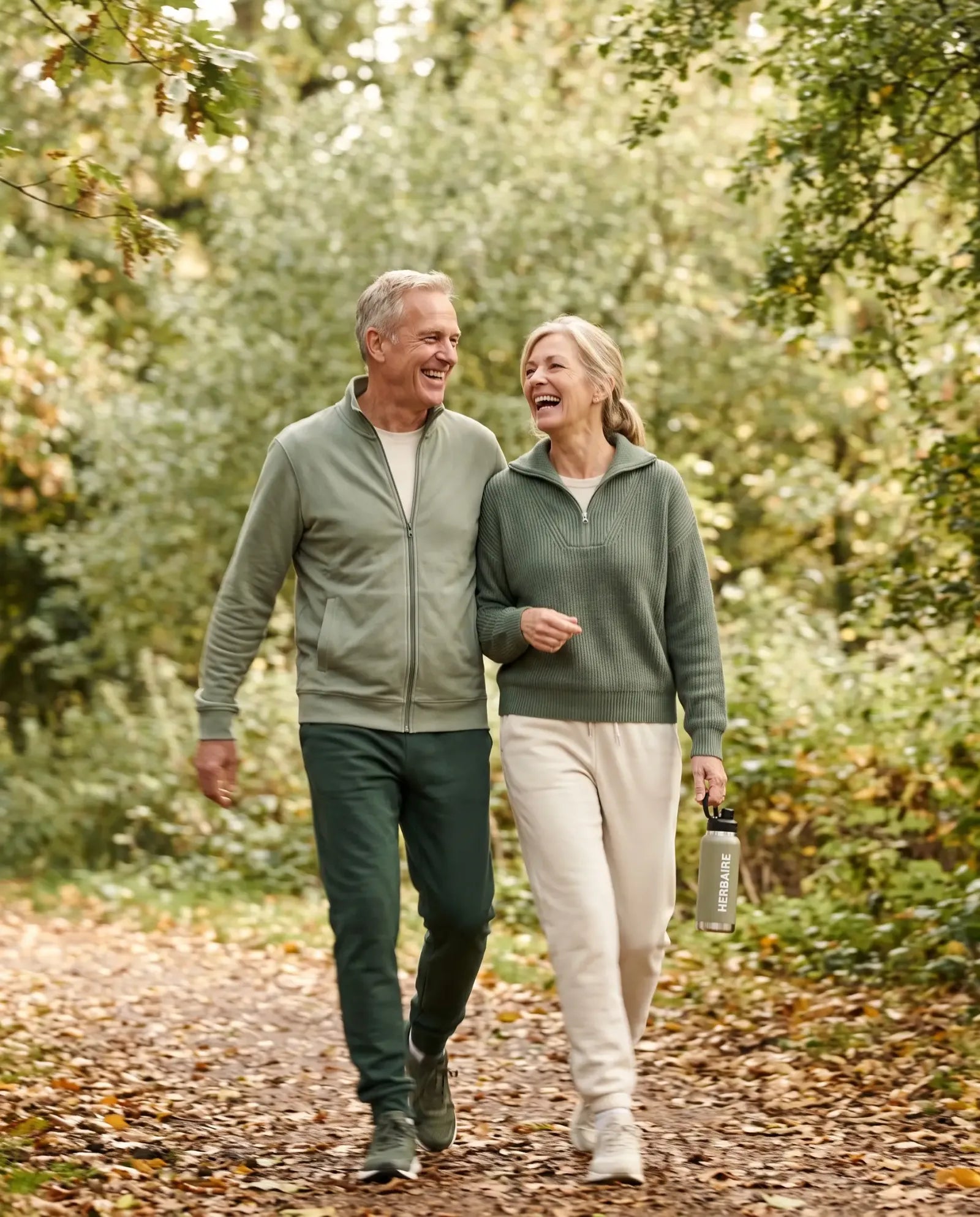 A couple walking briskly on a park path